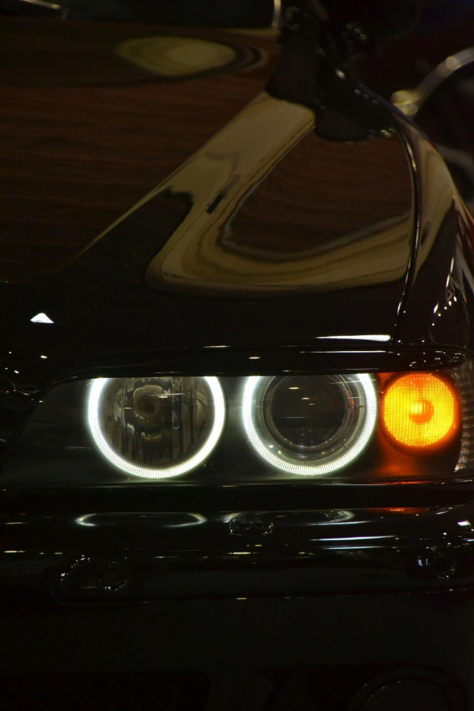 A close up of the headlights of a car